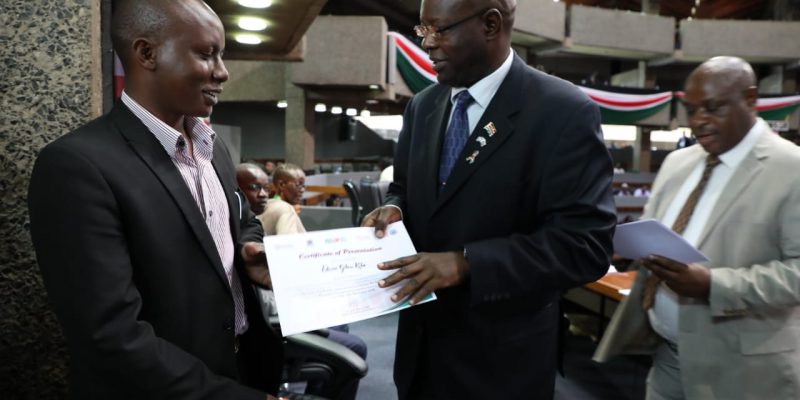 The chairman NACADA being awarded a certificate after presenting a Research Paper during International Conference at KICC Nairobi in Dec 2018